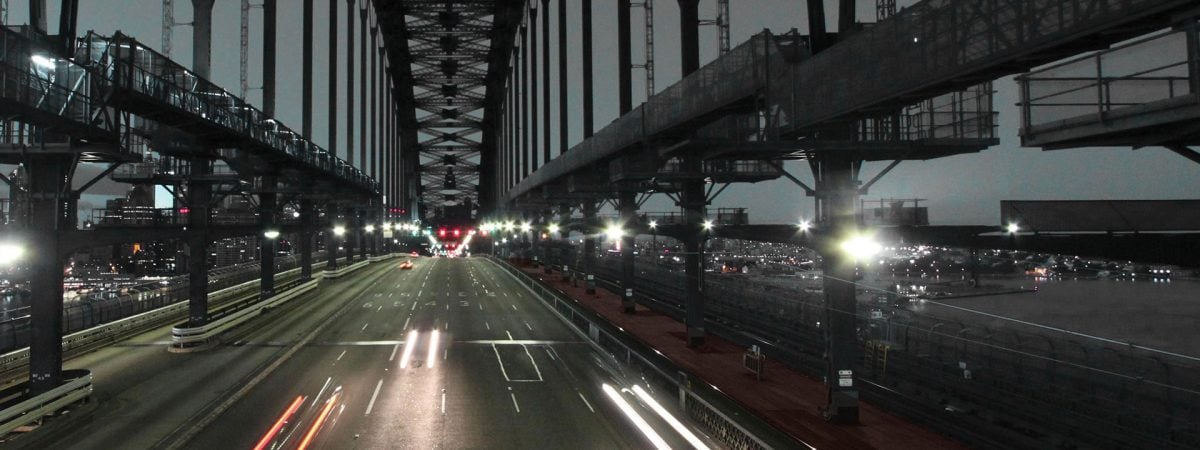 on the road in the harbour bridge at night